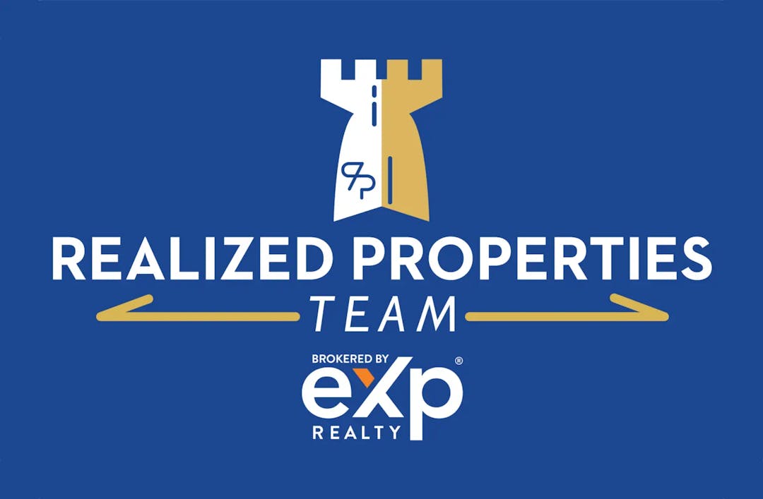 blue logo for Realized Properties showing castle