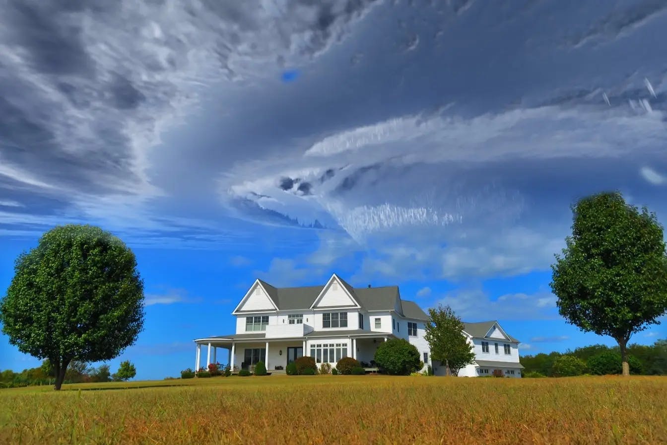 A nice rural home with clouds above